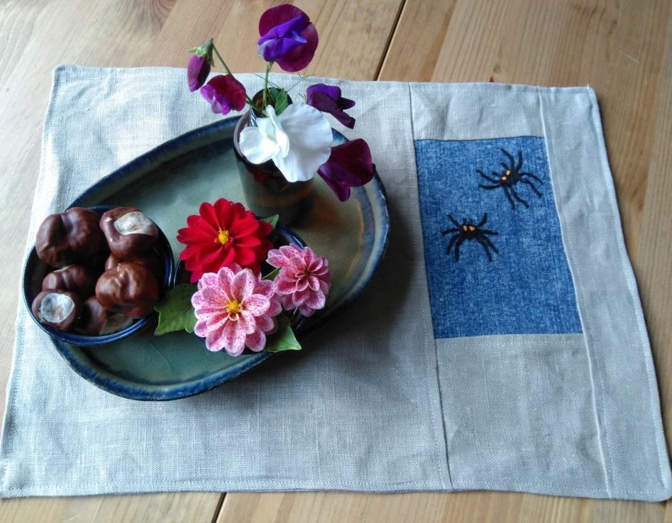 Spider embroidery on placemats