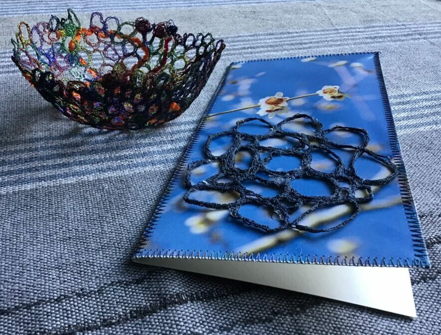 A card and a bowl made out of circles sewn on water dissoluble fabric