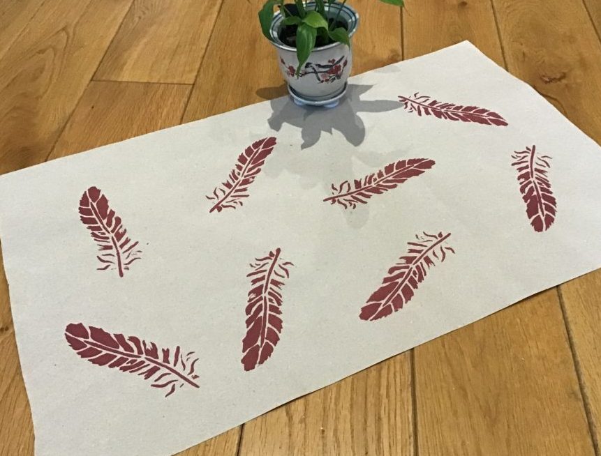 Recycled gift wrapping paper with feathers