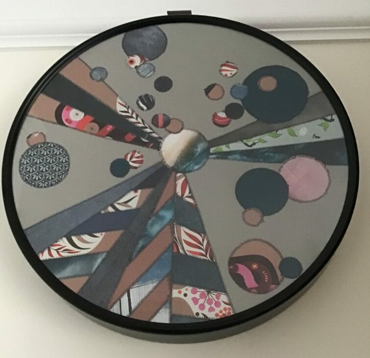 Paper patchwork picture in frame from old clock