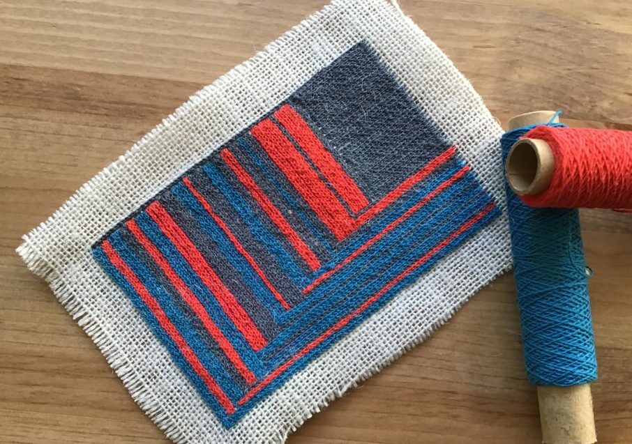 Tambour embroidering on recycled fabric using thin yarn