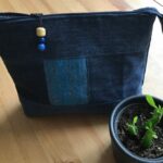 Wash bag made out of old jeans and other recycled materials