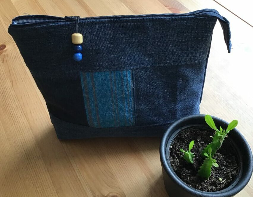 Wash bag made out of old jeans and other recycled materials