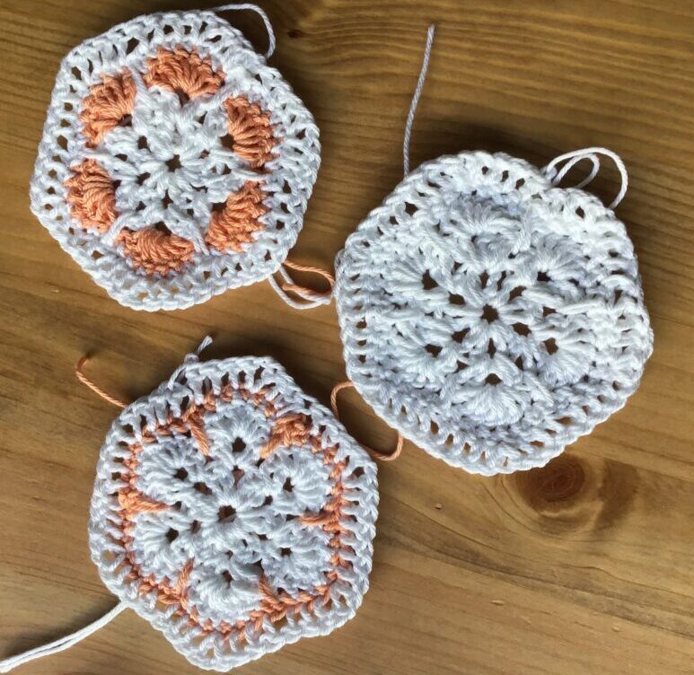 Granny squares crocheted in two colours